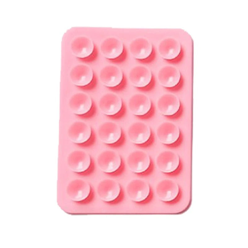 A sticky and multi-purpose grip pad, designed to hold your mobile phone securely on different surfaces.