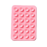 A sticky and multi-purpose grip pad, designed to hold your mobile phone securely on different surfaces.