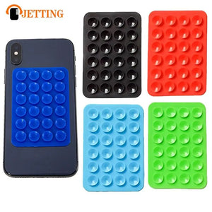 A sticky and multi-purpose grip pad, designed to hold your mobile phone securely on different surfaces.