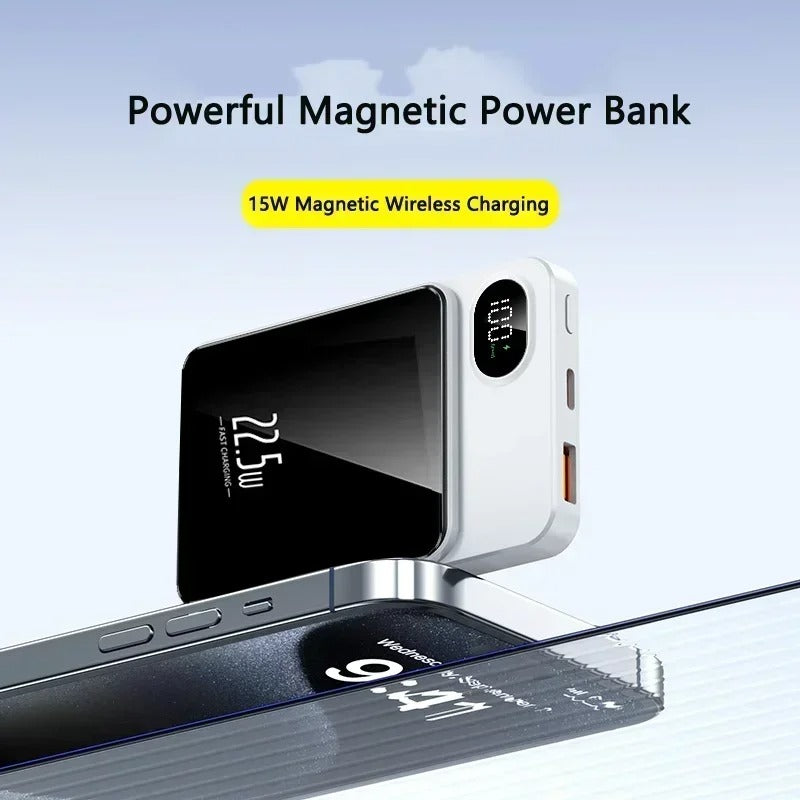 A portable charger attaches to the back of the phone with a magnet